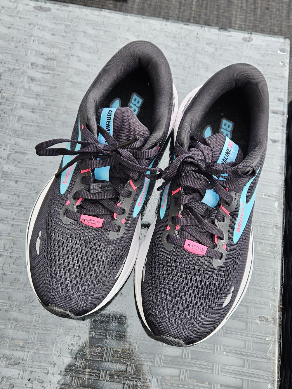 Brooks Women's Black Running Shoe with Pink and Teal Accents
